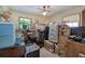 Cluttered attic space featuring a ceiling fan, a window, and lots of assorted items at 1001 Rhett Nw Dr, Kennesaw, GA 30144