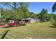 Expansive backyard perfect for outdoor activities, featuring a lush lawn and mature trees at 1001 Rhett Nw Dr, Kennesaw, GA 30144