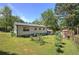 View of the home's exterior and backyard featuring mature trees at 1001 Rhett Nw Dr, Kennesaw, GA 30144