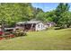 Expansive backyard perfect for outdoor activities, featuring a lush lawn and mature trees at 1001 Rhett Nw Dr, Kennesaw, GA 30144