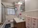 Cozy bathroom with a tiled shower/tub and vanity at 1001 Rhett Nw Dr, Kennesaw, GA 30144