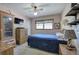 Bedroom features a ceiling fan and ample natural light from the window at 1001 Rhett Nw Dr, Kennesaw, GA 30144