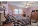 Bedroom features a window, fan, and carpeted floors at 1001 Rhett Nw Dr, Kennesaw, GA 30144