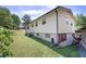 Exterior view of the back of the house with a large backyard at 1001 Rhett Nw Dr, Kennesaw, GA 30144