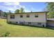 Exterior view of the back of the house featuring a spacious backyard at 1001 Rhett Nw Dr, Kennesaw, GA 30144