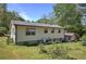 Exterior view of the back of the house, featuring a large backyard at 1001 Rhett Nw Dr, Kennesaw, GA 30144