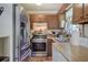 Galley kitchen featuring stainless steel appliances and plenty of counter space at 1001 Rhett Nw Dr, Kennesaw, GA 30144