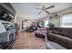 Cozy living room with hardwood floors, a decorative fireplace, and ample natural light at 1001 Rhett Nw Dr, Kennesaw, GA 30144