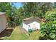 Exterior shot of a weathered shed on a large lot with a lawnmower and ladder at 1001 Rhett Nw Dr, Kennesaw, GA 30144