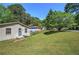 Spacious front yard featuring a mature tree and a partial view of neighboring homes at 1001 Rhett Nw Dr, Kennesaw, GA 30144