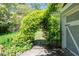 A lush, green archway leads to a serene backyard at 414 Pensdale Rd, Decatur, GA 30030