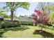 Manicured backyard with lush lawn and storage shed at 414 Pensdale Rd, Decatur, GA 30030