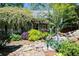 Beautifully landscaped backyard with a serene waterfall feature and lush foliage at 414 Pensdale Rd, Decatur, GA 30030