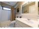 Bathroom featuring tile floors, white sink, and bathtub with striped shower curtain at 414 Pensdale Rd, Decatur, GA 30030