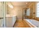 Bathroom featuring a walk-in shower and separate bathtub at 414 Pensdale Rd, Decatur, GA 30030