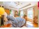 Bedroom with natural light, tray ceiling, hardwood floors, and detailed trim at 414 Pensdale Rd, Decatur, GA 30030