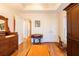 Bedroom featuring hardwood floors, wardrobe, wooden drawers, and a table with chairs at 414 Pensdale Rd, Decatur, GA 30030