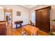 Bedroom featuring hardwood floors, wooden wardrobe, and a table with wooden chairs at 414 Pensdale Rd, Decatur, GA 30030