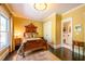 Bedroom with hardwood floors, large window, and doorway to bathroom at 414 Pensdale Rd, Decatur, GA 30030