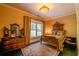 Cozy bedroom featuring hardwood floors, an antique bed frame, and large window at 414 Pensdale Rd, Decatur, GA 30030