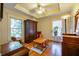 Bedroom with hardwood floors, a wooden wardrobe, a table with chairs, and recessed lighting at 414 Pensdale Rd, Decatur, GA 30030