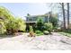 Charming home featuring a screened porch, lush landscaping, and a spacious driveway at 414 Pensdale Rd, Decatur, GA 30030