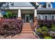 Inviting front porch with brick stairs and lush landscaping at 414 Pensdale Rd, Decatur, GA 30030
