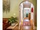 Hallway featuring hardwood floors, tan paint, and a view into other rooms at 414 Pensdale Rd, Decatur, GA 30030