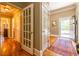 Hallway featuring hardwood floors and multiple doorways at 414 Pensdale Rd, Decatur, GA 30030
