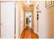 Hallway with hardwood floors, white walls and white doors with decorative trim at 414 Pensdale Rd, Decatur, GA 30030