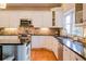 Beautiful kitchen with white cabinetry, granite countertops, and stainless steel appliances at 414 Pensdale Rd, Decatur, GA 30030