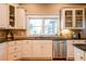 Stylish kitchen featuring white cabinets, granite countertops, and stainless steel appliances at 414 Pensdale Rd, Decatur, GA 30030