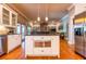 Spacious kitchen with stainless steel appliances, hardwood floors, island and access to other living areas at 414 Pensdale Rd, Decatur, GA 30030