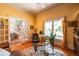 Bright living room featuring hardwood floors, a glass table, and a view of the staircase at 414 Pensdale Rd, Decatur, GA 30030