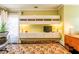 Well-lit living room with decorative wall-mounted shelves, and a floral patterned rug at 414 Pensdale Rd, Decatur, GA 30030