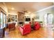 Spacious living room features a stone fireplace, built-in bookshelves, and hardwood floors at 414 Pensdale Rd, Decatur, GA 30030