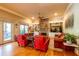 Cozy living room featuring a stone fireplace, built-in shelving, hardwood floors, and comfortable furniture at 414 Pensdale Rd, Decatur, GA 30030