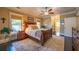 Bedroom with a ceiling fan, large windows, and en suite bathroom at 414 Pensdale Rd, Decatur, GA 30030