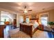 Main bedroom featuring a ceiling fan, large windows, and a sitting area at 414 Pensdale Rd, Decatur, GA 30030