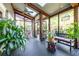 Spacious screened porch has ceiling fans, skylights, seating area and lots of greenery for a relaxing atmosphere at 414 Pensdale Rd, Decatur, GA 30030