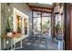 Inviting screened porch with tiled floor, ceiling fan and skylights provides a relaxing seating area at 414 Pensdale Rd, Decatur, GA 30030