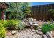 Beautiful multi-tiered rock water feature set against a wooden fence at 414 Pensdale Rd, Decatur, GA 30030