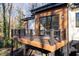 Exterior back porch with wood deck and metal railing at 4366 Skyland Ne Dr, Atlanta, GA 30342