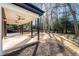 Back yard with covered porch and ceiling fans at 4366 Skyland Ne Dr, Atlanta, GA 30342