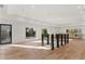 Finished basement offers an open floor plan with hardwood floors and a bar area at 4366 Skyland Ne Dr, Atlanta, GA 30342