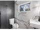 Bathroom with a glass shower, gray tile, and modern vanity at 4366 Skyland Ne Dr, Atlanta, GA 30342