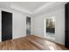 Bedroom features hardwood floors, closet, and a large window with scenic views at 4366 Skyland Ne Dr, Atlanta, GA 30342