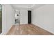 Bright bedroom features hardwood floors and access to a modern bathroom with black fixtures at 4366 Skyland Ne Dr, Atlanta, GA 30342