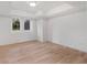 Bright bedroom with hardwood floors, two windows, and white walls at 4366 Skyland Ne Dr, Atlanta, GA 30342
