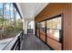 Spacious deck with black railing, featuring modern wood and glass sliding doors at 4366 Skyland Ne Dr, Atlanta, GA 30342